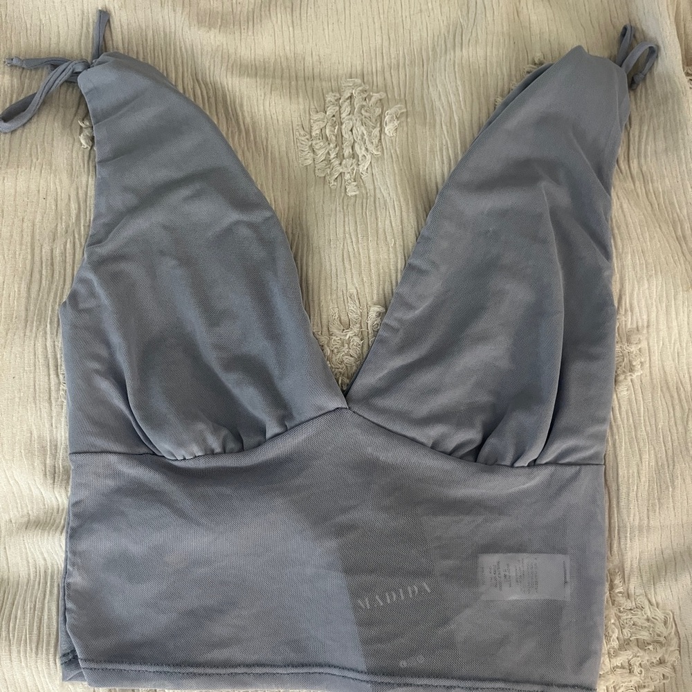 light blue/purple tank top with tie shoulders, mesh body